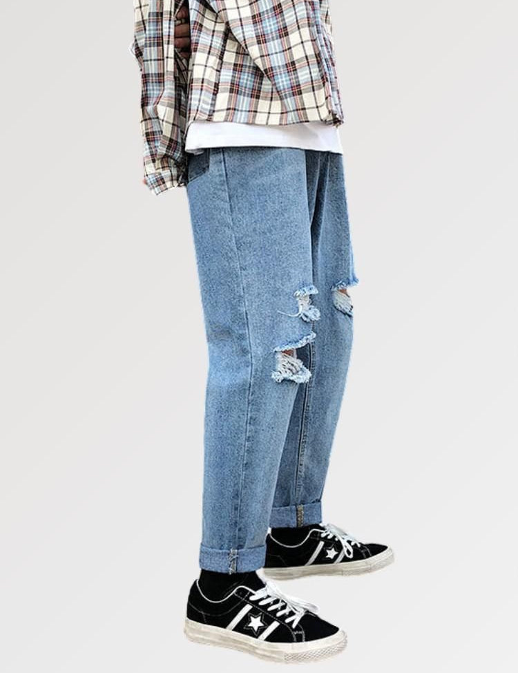 hellblaue zerrissene Jeans bedeutet